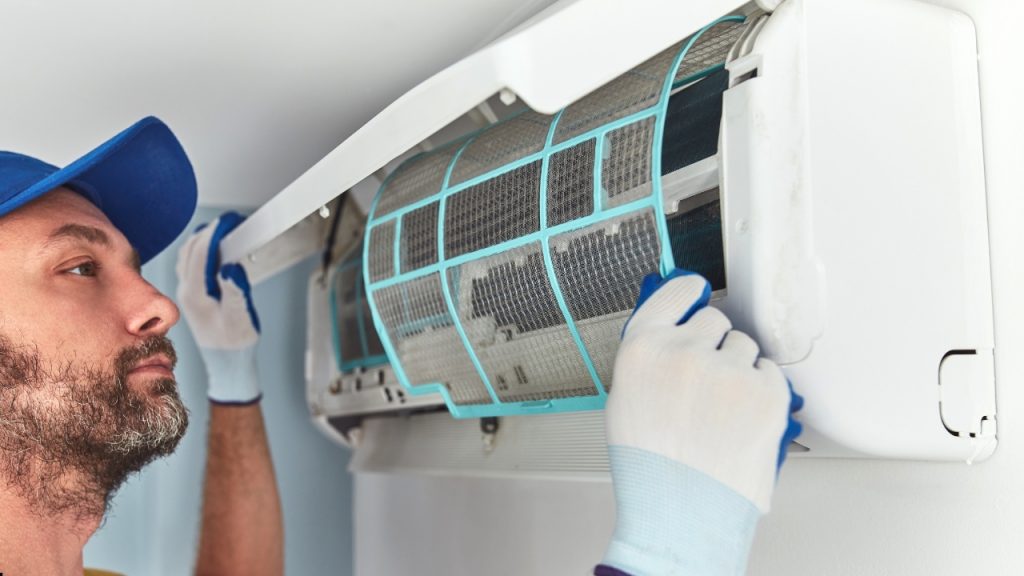 licensed installer installing Split System ac