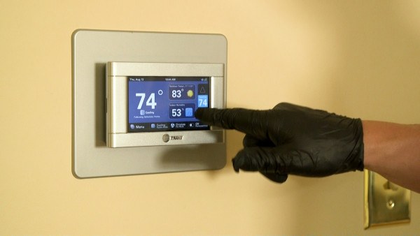 home thermostat showing heating zones, emphasizing ducted system complexity